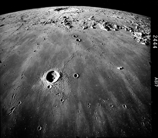 An image of the gray, crater-pocked face of the moon, taken by Apollo astronauts