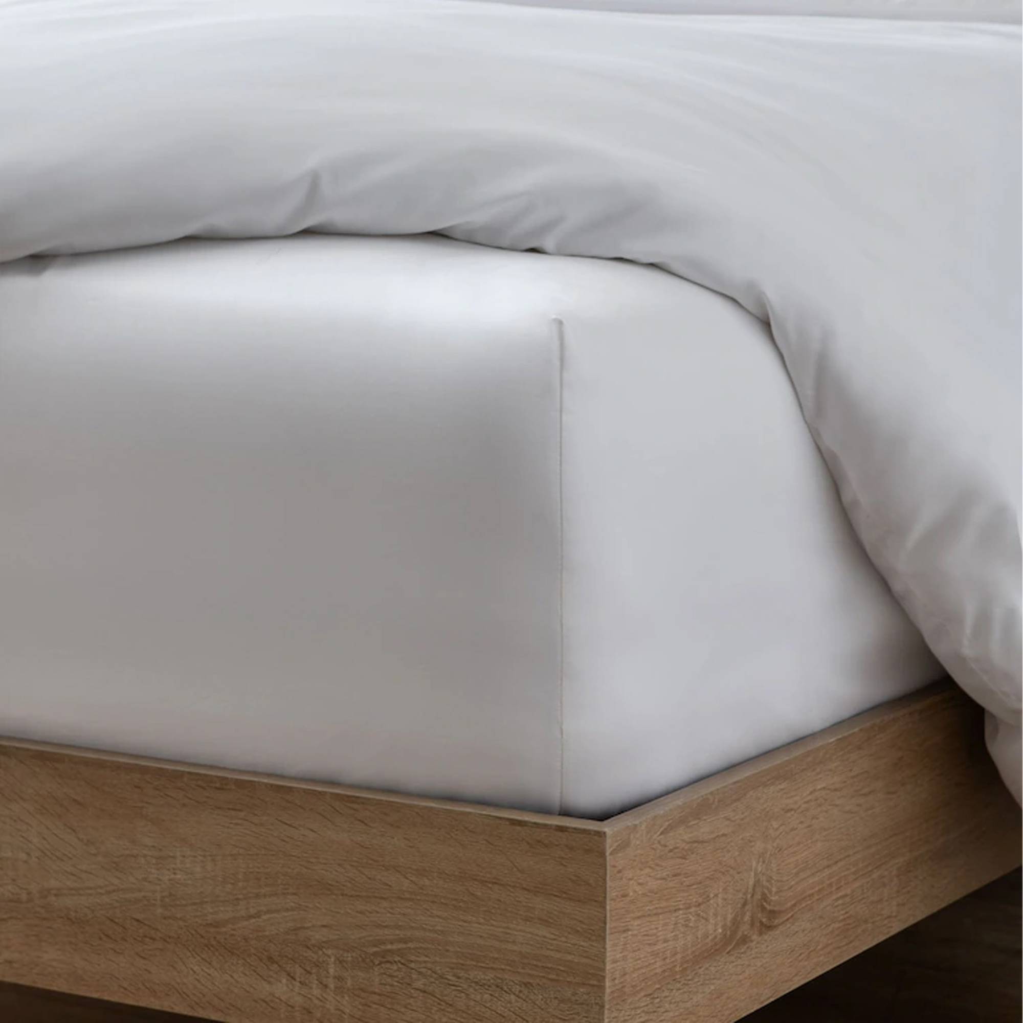 Next fitted sheet hugging the mattress corner