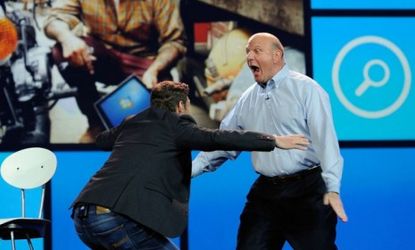 Ryan Seacrest and Steve Ballmer go in for a hug during the Microsoft CEO's final keynote speech at the Consumer Electronics Show in Las Vegas.