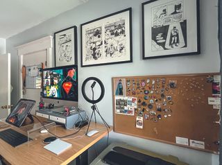 Artist in residence; comic pages framed on a wall