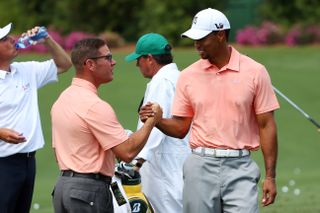 Sean Foley and Tiger Woods shake hands at the 2013 Masters
