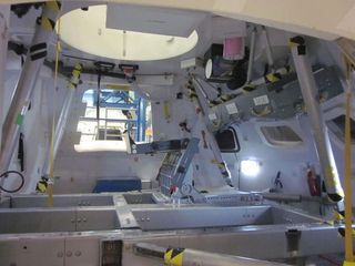This view inside a mockup of NASA’s new Orion space capsule shows a seat for an astronaut (eventually there will be four seats inside). Astronauts will lay on their backs with legs pointing up in the air on the leg rests, shown here.