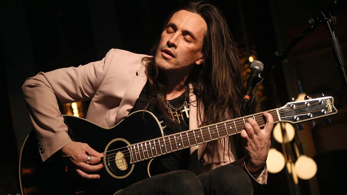 Nuno Bettencourt says Extreme used a demo recording for their smash-hit Hole Hearted, and the guitar was recorded via a headset mic taped to his knee