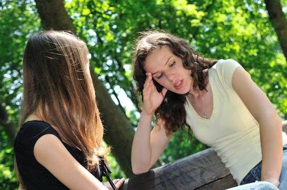 two women having a serious conversation