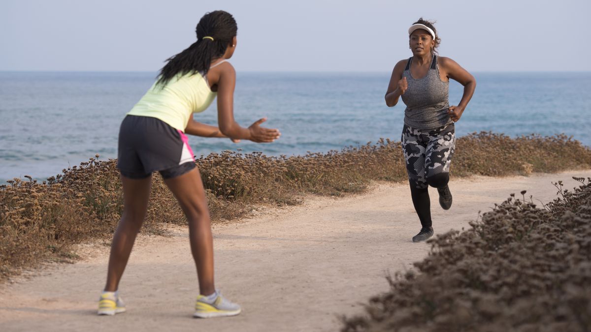 Coach encouraging runner