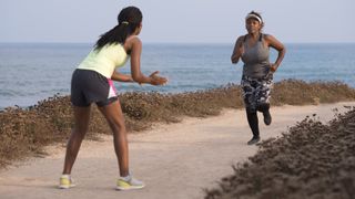 Coach encouraging runner