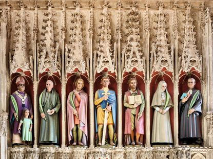 Fig 6: Rory Young’s rood-screen figures, consecrated in 2015, with St Alban in the centre, flanked by ancient and modern saints. St Albans Cathedral. ©Paul Highnam for Country Life