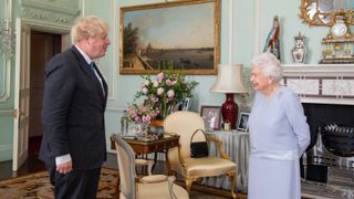 Queen Elizabeth greets Prime Minister Boris Johnson during an audience at Buckingham Palace in central London on June 23, 2021