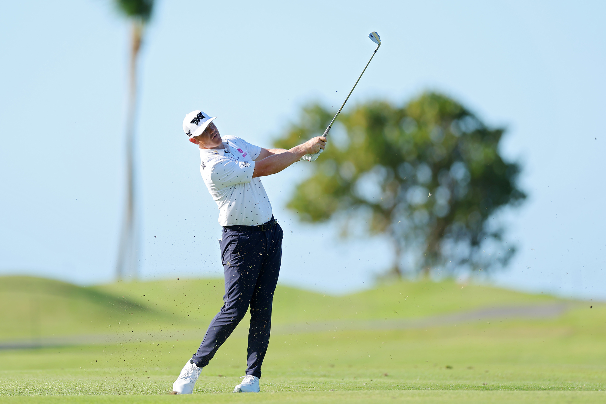 Patrick Fishburn hitting an iron shot at a PGA Tour event
