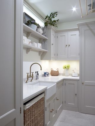 small and grey utility room with white worktops and LED undershelf lighting