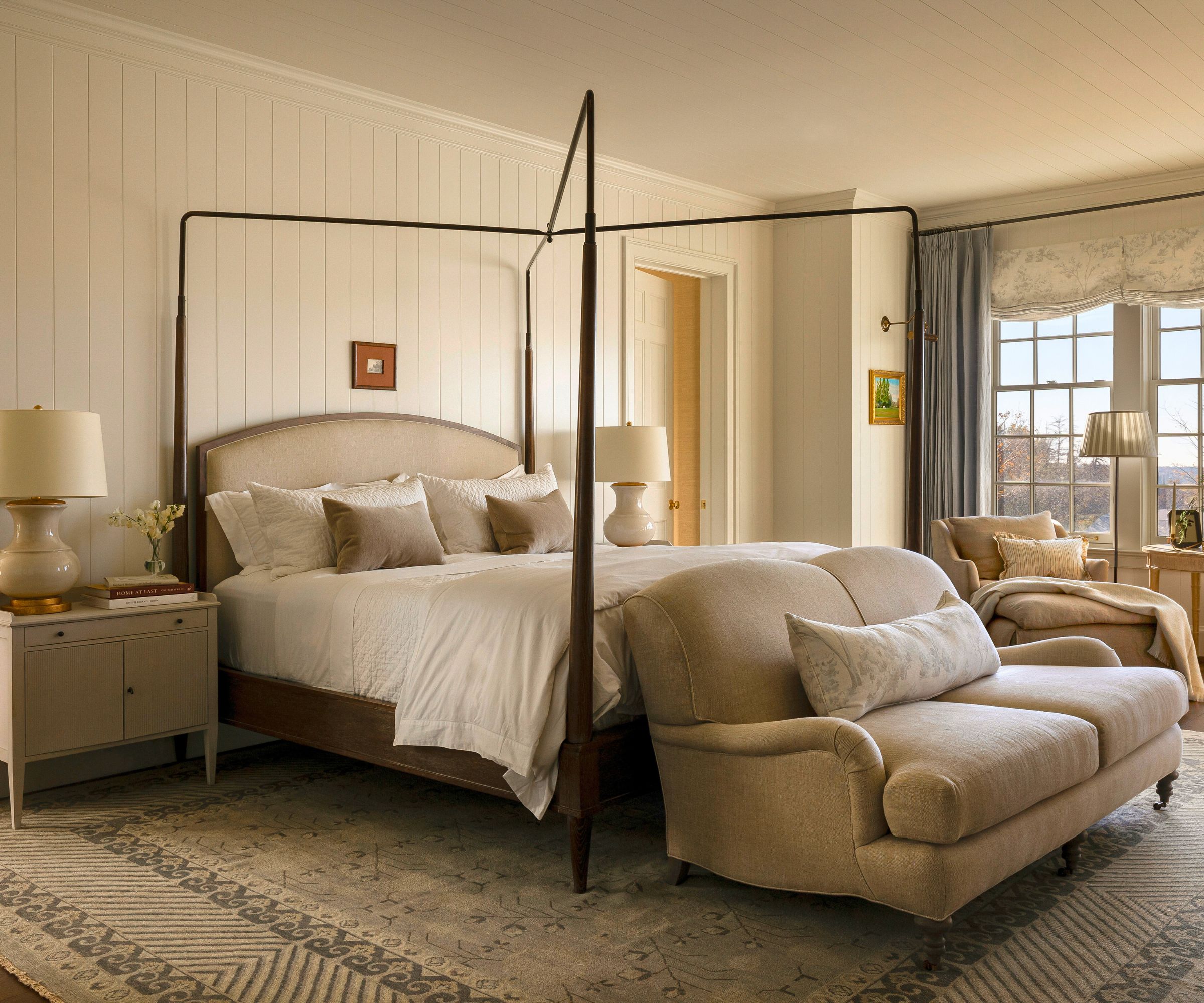 primary bedroom with paneled walls