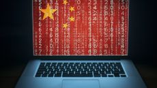 China's flag overlays laptop screen