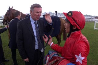 Sir Alex Ferguson talks to jockey Frankie Dettori at York in May 2001.