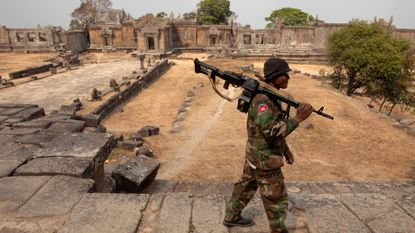 A Cambodian solider guards the grounds of the 11th-century Preah Vihear temple