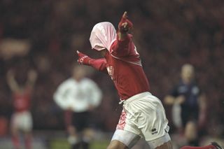 Fabrizio Ravanelli celebrates by pulling his shirt over his head after scoring for MIddlesbrough against Manchester United in November 1996.