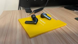 EarFun Air Pro 4 earbuds on a desk