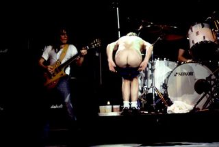 Angus bares his arse onstage