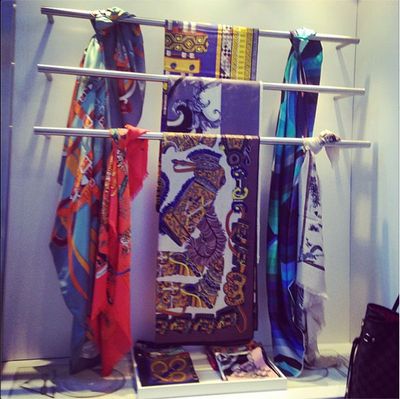 Textile, Bag, Luggage and bags, Baggage, Advertising, Visual arts, Suitcase, Display case, Silk, Feather,