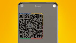 An Android phone on an orange background scanning a QR code