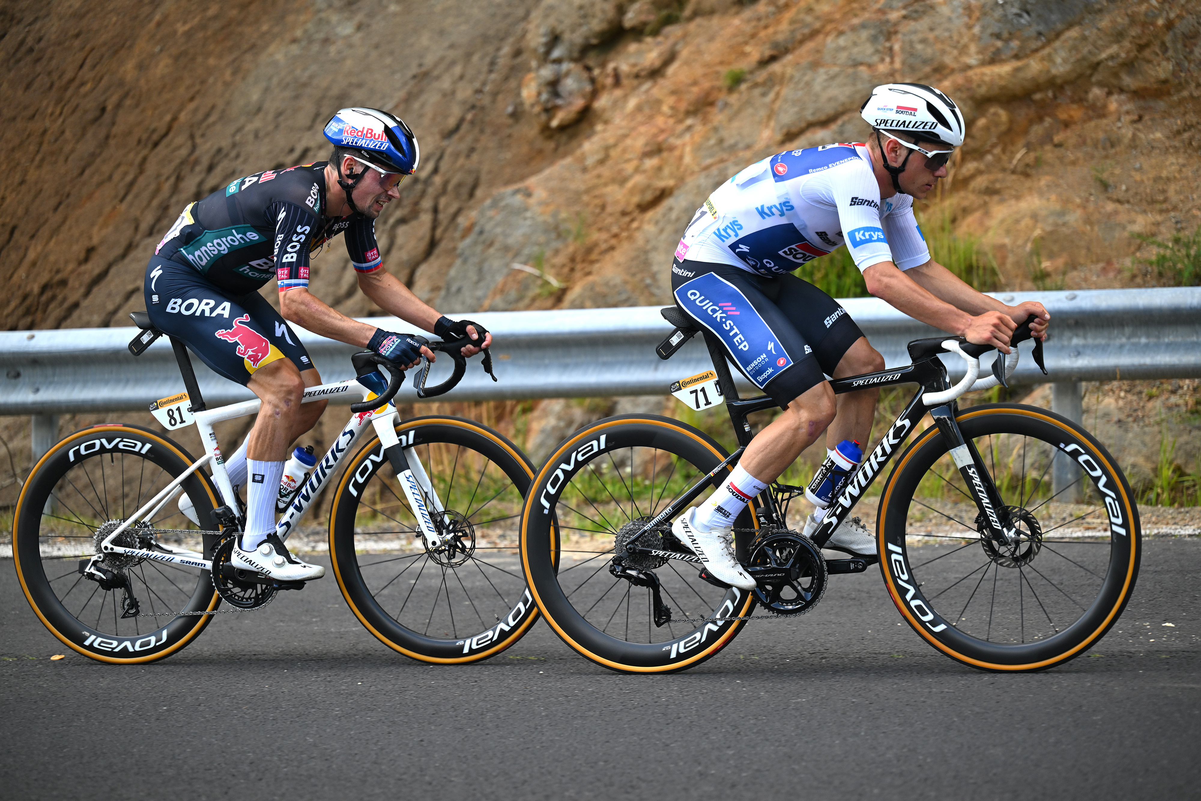 LE-LIORAN, FRANCE - JULY 10: (L-R) Primoz Roglic of Slovenia and Team Red Bull â€“ BORA â€“ hansgrohe and Remco Evenepoel of Belgium and Team Soudal Quick-Step - White best young jersey compete during the 111th Tour de France 2024, Stage 11 a 211km stage from Evaux-les-Bains to Le Lioran (1239m) / #UCIWT / on July 10, 2024 in Le Lioran, France. (Photo by Tim de Waele/Getty Images)
