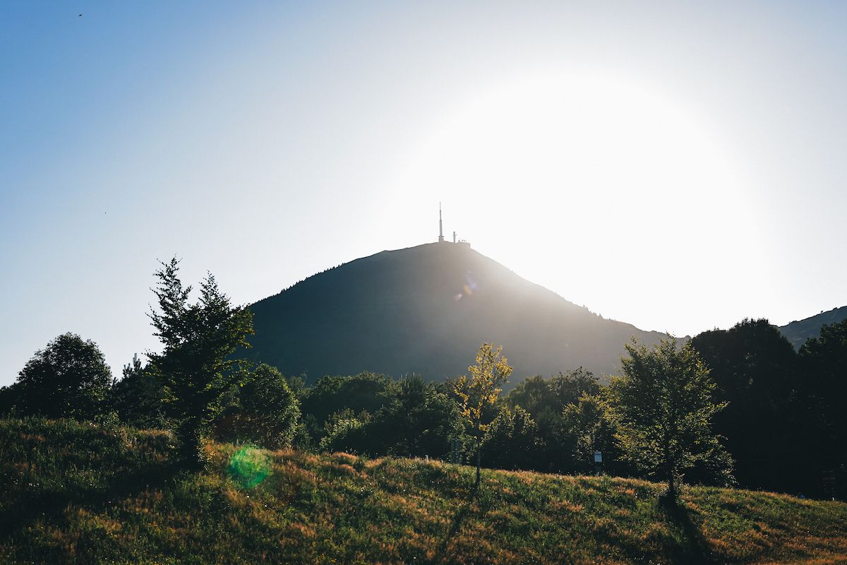 Puy de Dôme with the sun at its back from a distance
