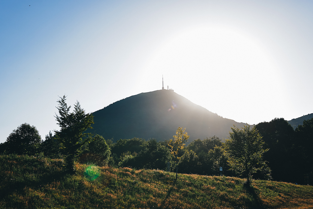 Puy de D&amp;ocirc;me with the sun at its back from a distance