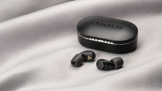 QuietOn 4 Sleep Earbuds on a gray background.