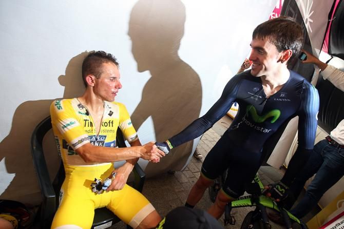 Rafal Majka (Tinkoff - Saxo) receives a congratulatory handshake from Jon Izaguirre (Movistar)