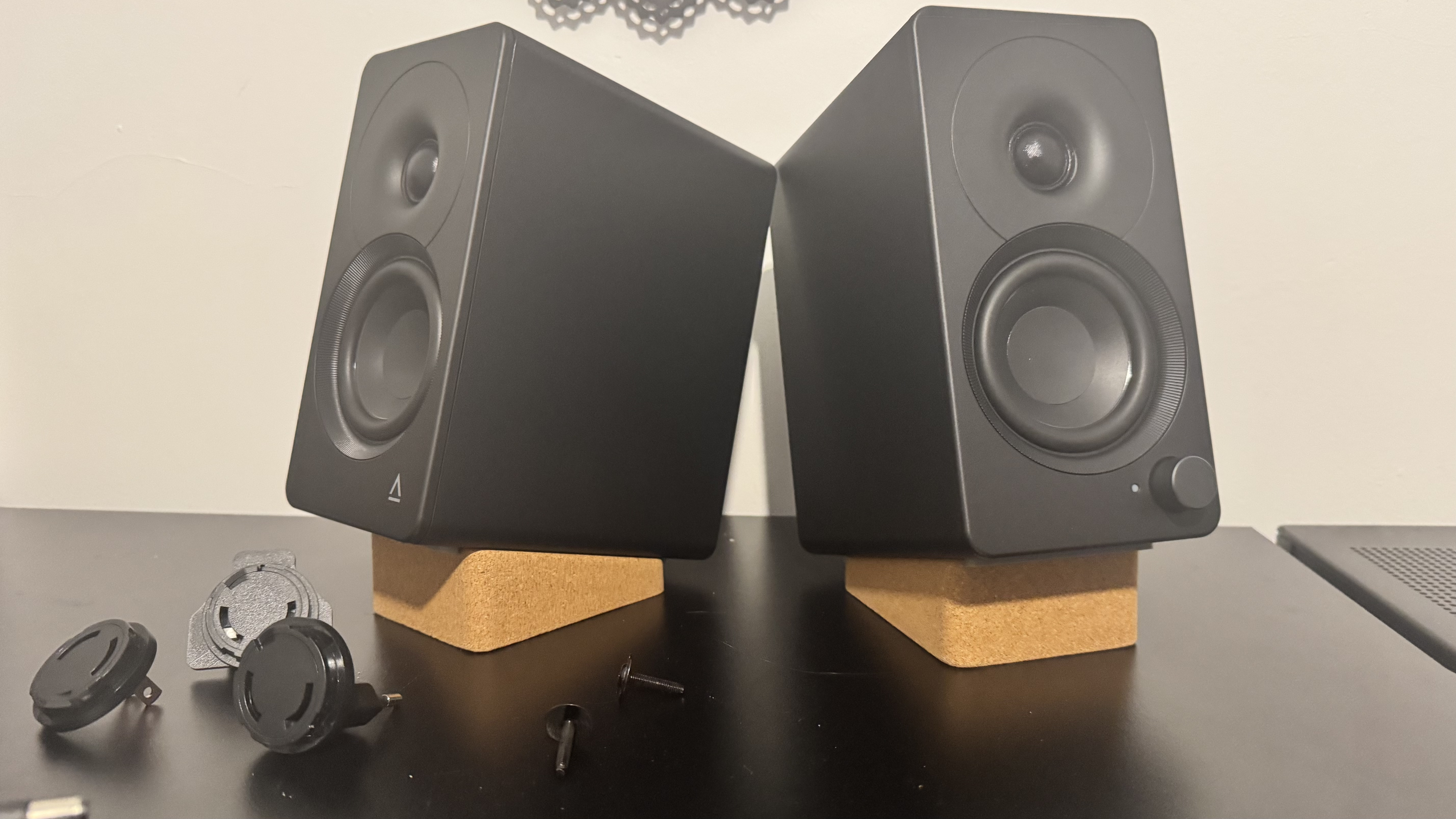 Creative XF1 speakers on a black desk