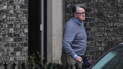 Peter Mandelson leaving a building