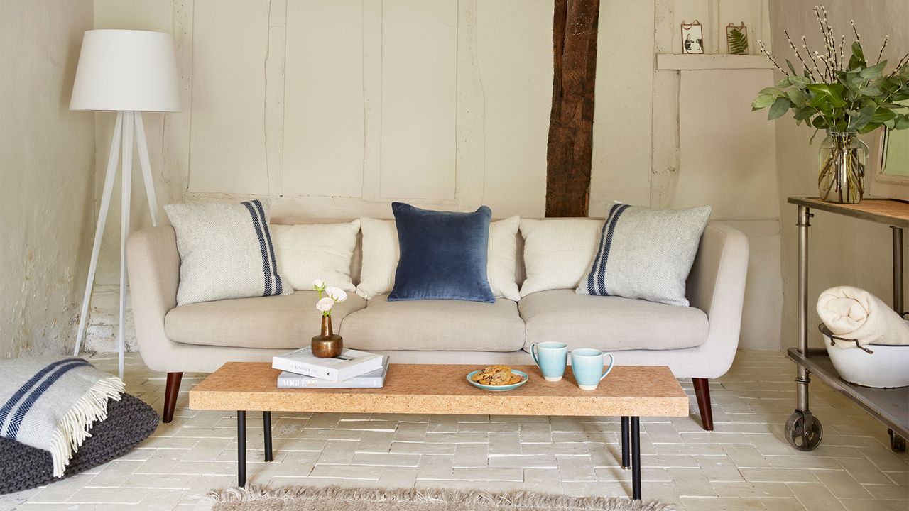 panelled living room with beige sofa and coffee table