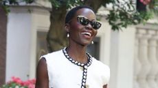 Lupita Nyong'o wearing a monochrome chanel boucle tweed outfit