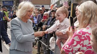 Britain's Queen Camilla (L) meets well-wishers after a visit to The great Tapestry of Scotland visitor centre in Galashiels, south of Edinburgh on July 6, 2023, to mark the 10th anniversary of the tapestry's completion.