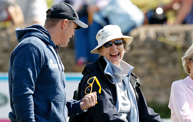 On home turf: Princess Anne shares a joke with her son-in-law Mike Tindall, in the grounds of her home