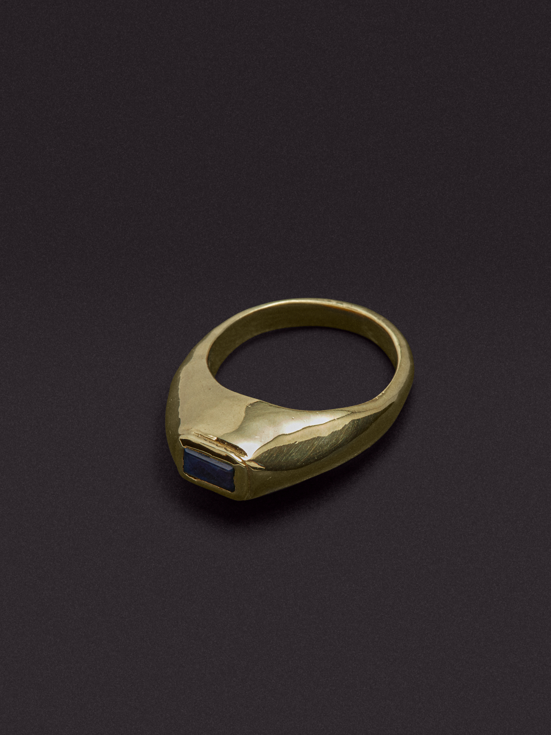 gold and silver jewellery against coloured backgrounds