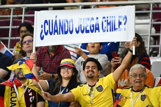 Ecuador supporters display a sign reading "When does Chile play ?" ahead of the Qatar 2022 World Cup Group A football match between the Netherlands and Ecuador at the Khalifa International Stadium in Doha on November 25, 2022.