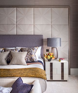 Above the bed decor with wall panelling behind the headboard