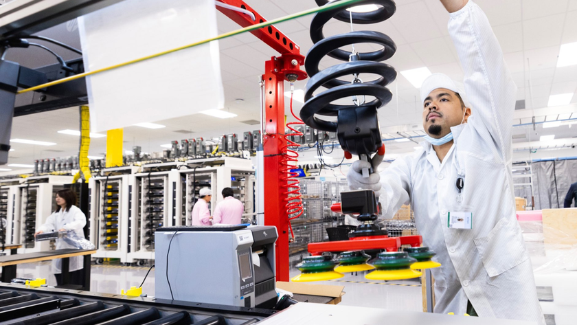A worker at Apple&#039;s Houston facility works on an assembly line. 