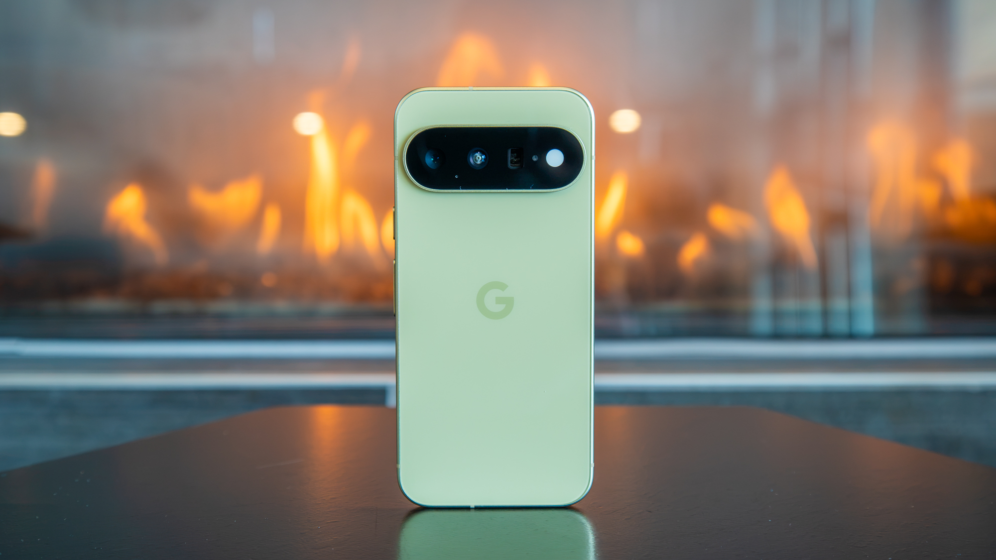The Pixel 11 in front of a fire