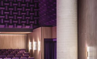 detail of screen room with purple seating and concrete column in sao paulo cinema teatro vivo