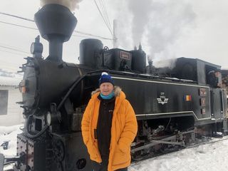 Chris Tarrant in front of a steam train in Romania