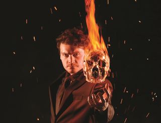 scary man with flaming skull head