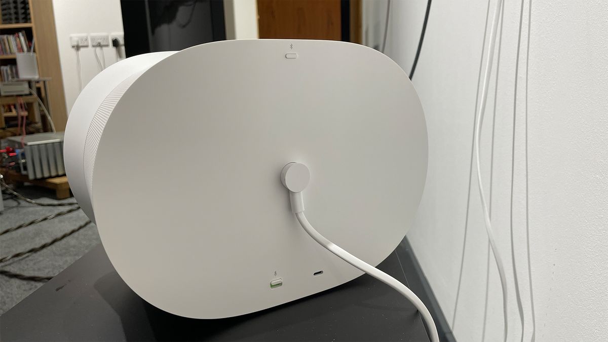 The back of a white Sonos Era 300 smart speaker. The power cable is attached in the middle and at the bottom some ports of visible.