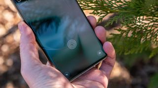 The in-glass fingerprint sensor on the OnePlus 11 Arbor Green colorway