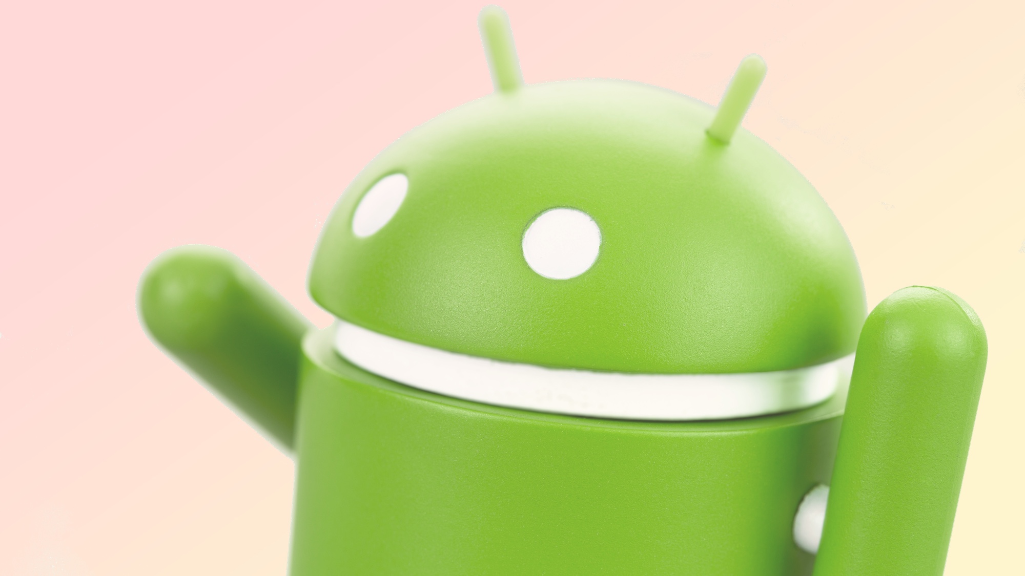 Green Android robot on peach background