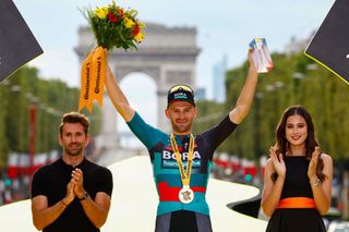 BORA hansgrohes Belgian rider Jordi Meeus celebrates his victory on the podium after winning the 21st and final stage of the 110th edition of the Tour de France cycling race 115 km between SaintQuentinenYvelines and the ChampsElysees in Paris on July 23 2023 Photo by Etienne GARNIER POOL AFP Photo by ETIENNE GARNIERPOOLAFP via Getty Images