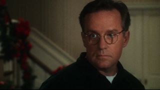 Phil Hartman stands looking disappointed in Jingle All The Way.