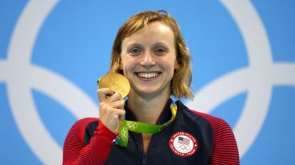 Katie Ledecky of United States celebrates on the podium after winning gold in the Women's 800m Freestyle Final on Day 7 of the Rio 2016 Olympic Games
