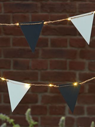 Bunting solar string lights hanging with flags