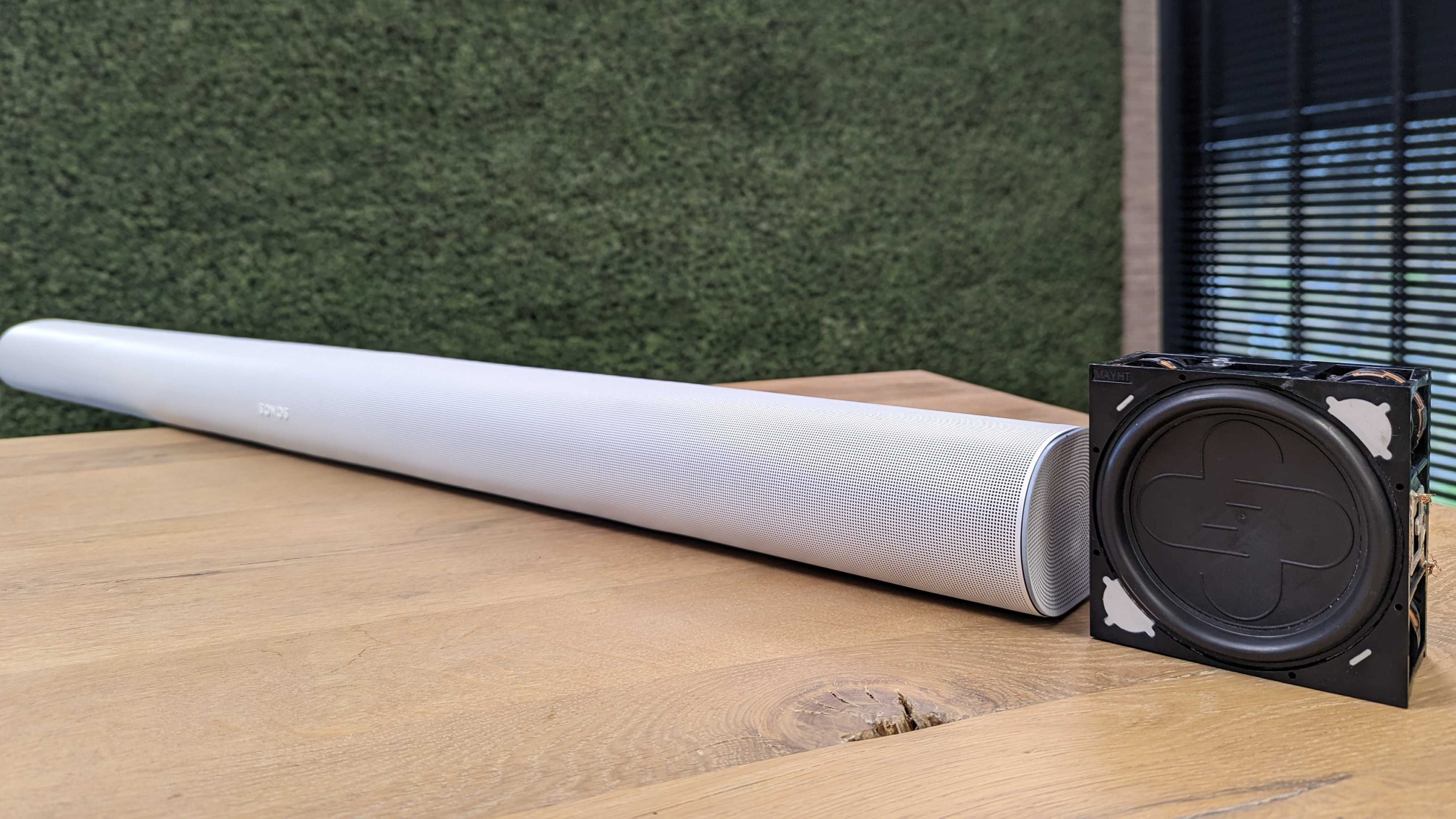 The Sonos Arc next to the original T3 Sound Motion speaker